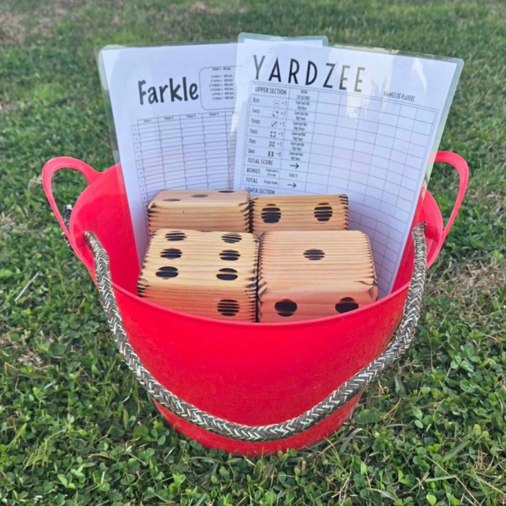 bucket with wooden dice in it and instructions for yardage and facile